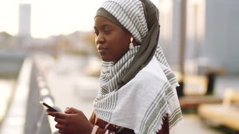 Black-Woman-Using-Phone-Outdoors